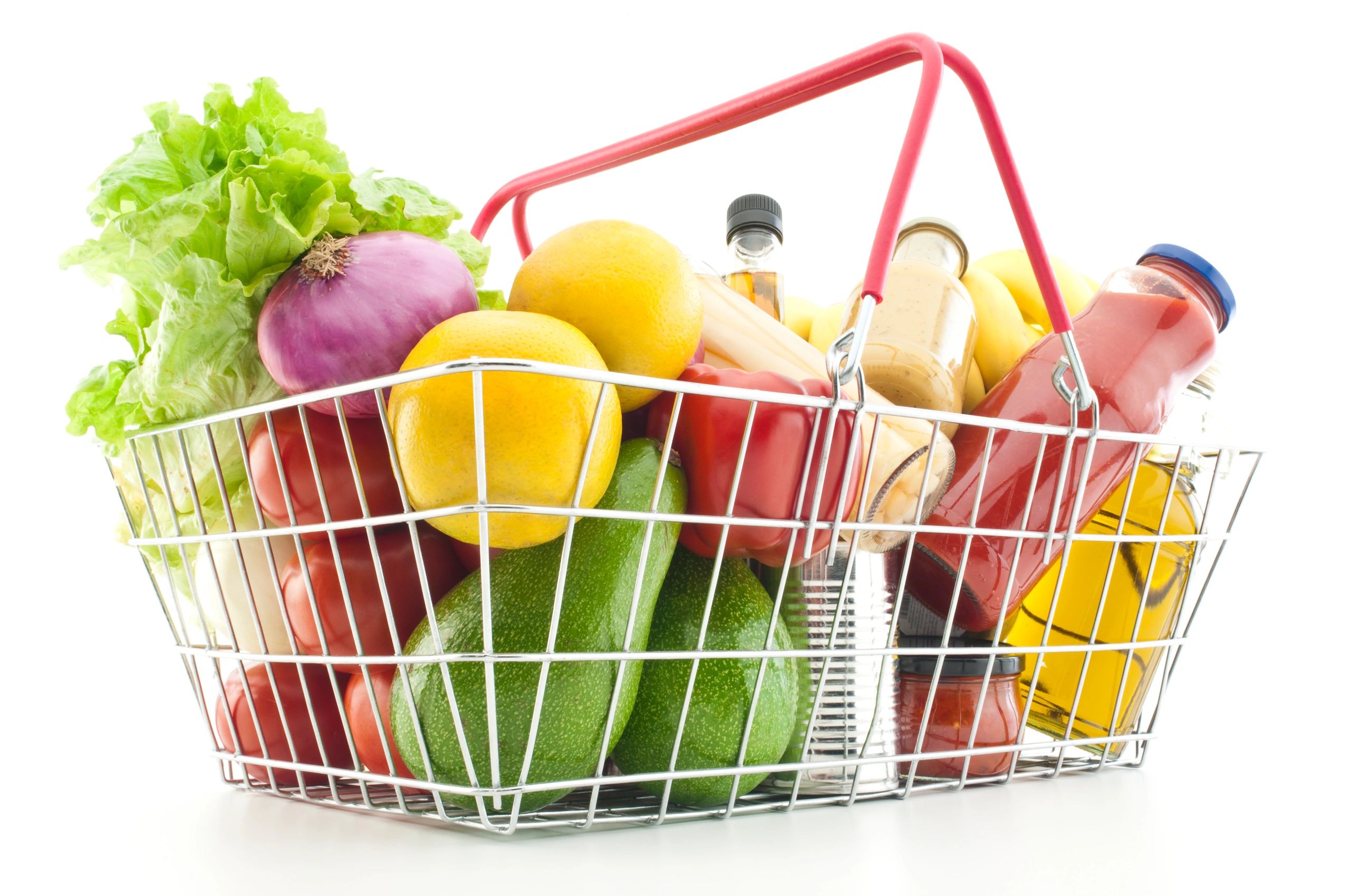 Shopping basket filled with groceries and vegetables